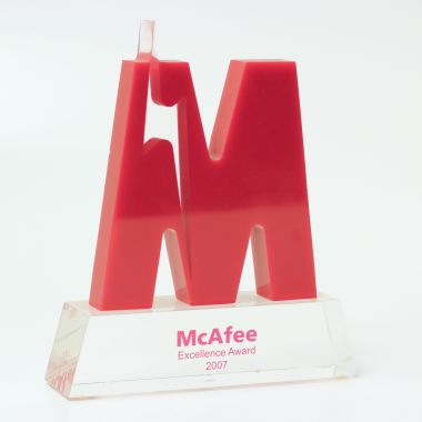 M shaped letter award with lightning streak on a base