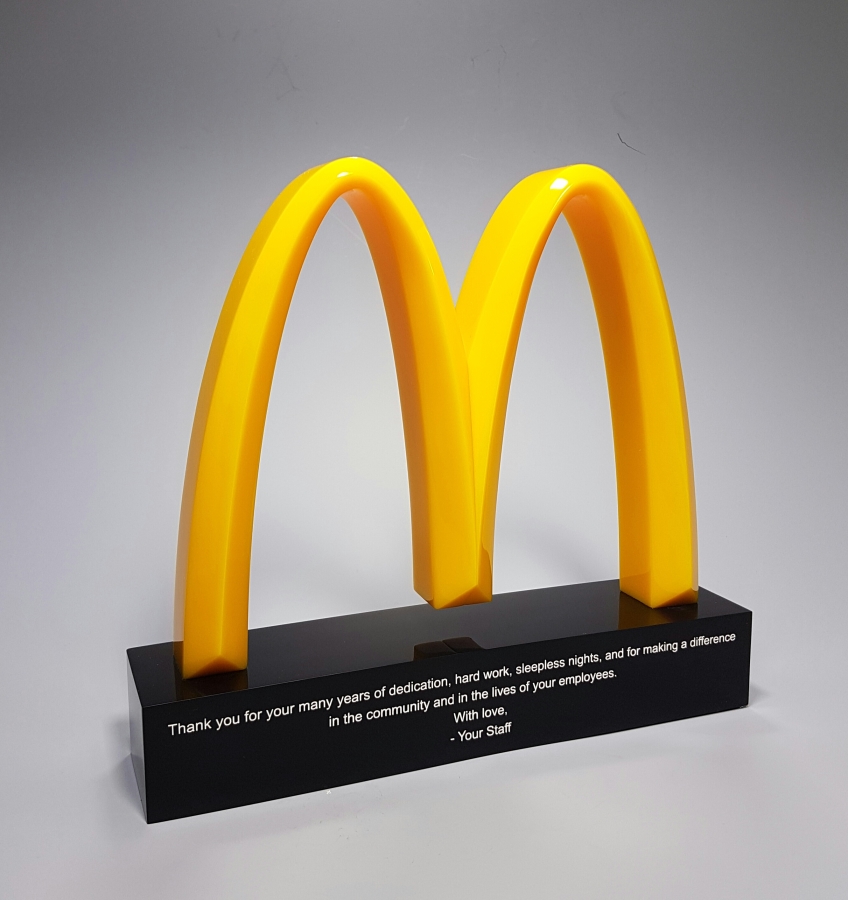 McDonald's yellow arch M logo award and trophy
