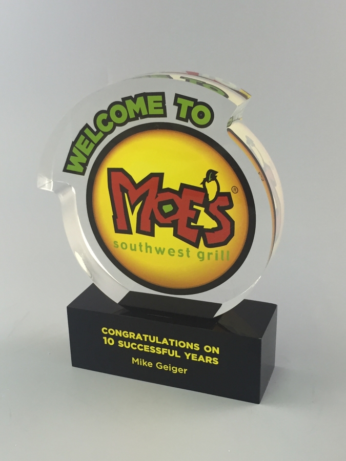 Custom shaped circle award with base and logo embedded in Lucite award