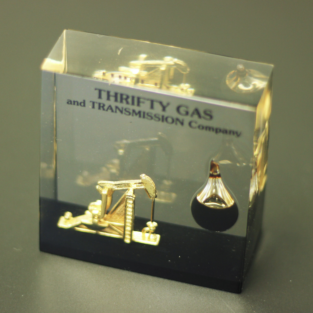 Dual custom cast replica of oil rig and oil encapsulated in glass embedment bespoke award