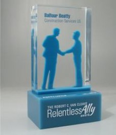 Custom Lucite award with laser cut figurines floating or embedded inside  shaking hands
