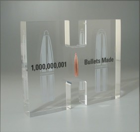 Custom Lucite gift with bullet embedded also used for award or display purposes  ammunition