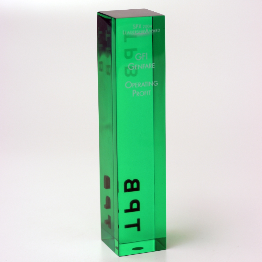 Tinted green Lucite award with embedment and surface etching