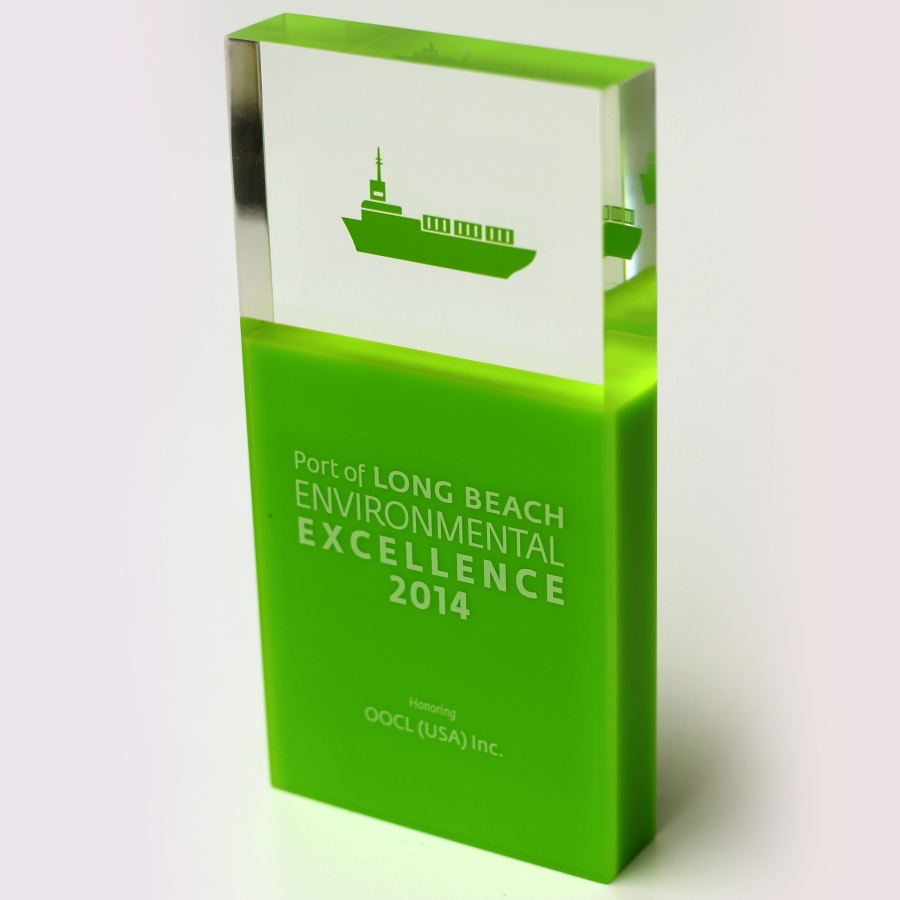 Green and clear Lucite award with embedment and surface printing