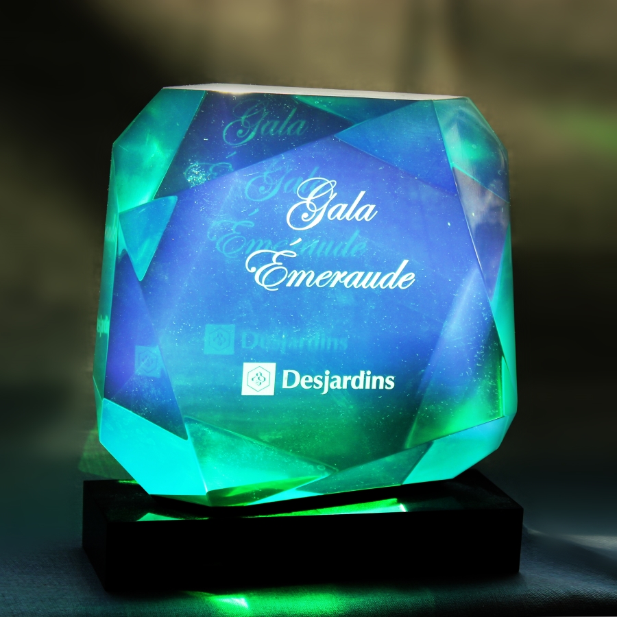 Custom emerald shaped Lucite on black base with etching for award or trophy