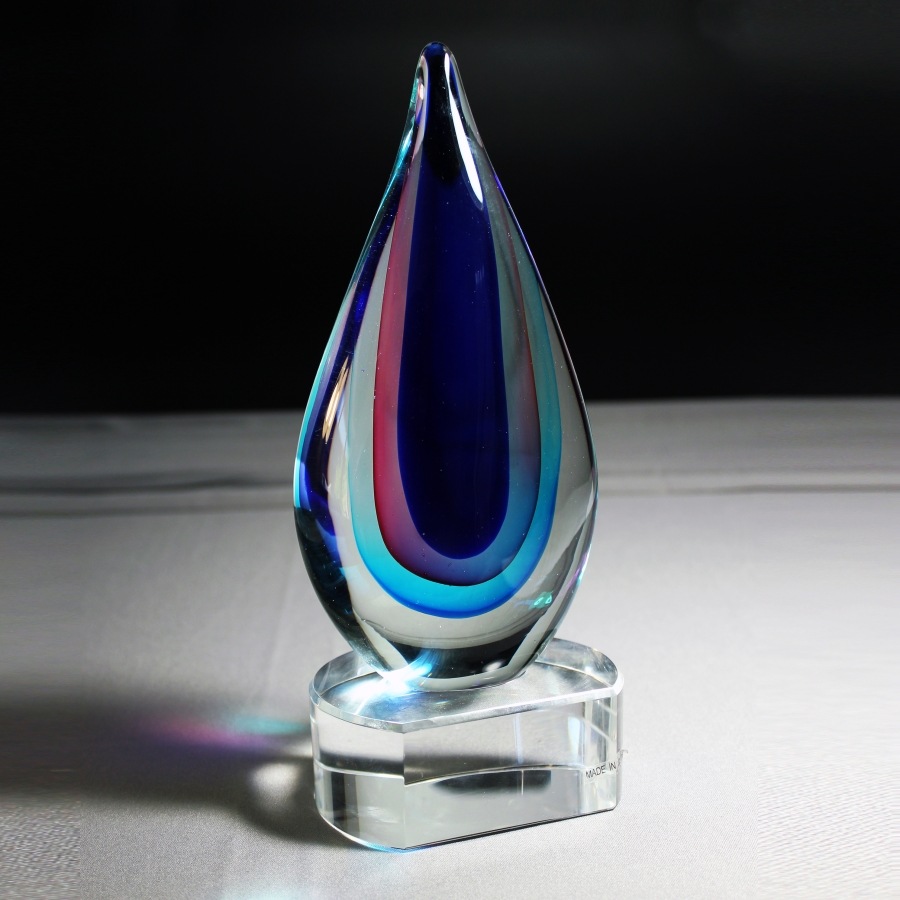 Glass abstract award on clear base award or trophy