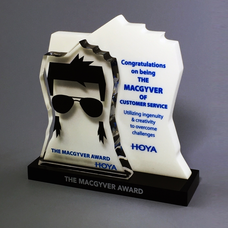 Macgyver award clear and white Lucite with black base trophy and award