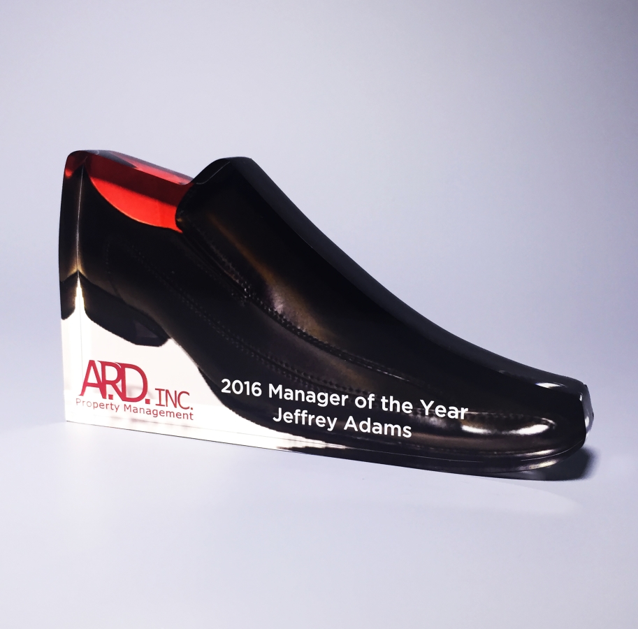 Black dress shoe out of Lucite award gift or trophy