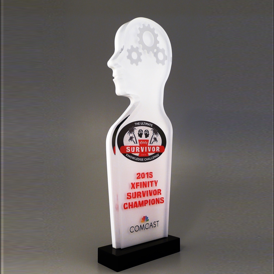Outline of a human head and torso made from Lucite on a black base award trophy