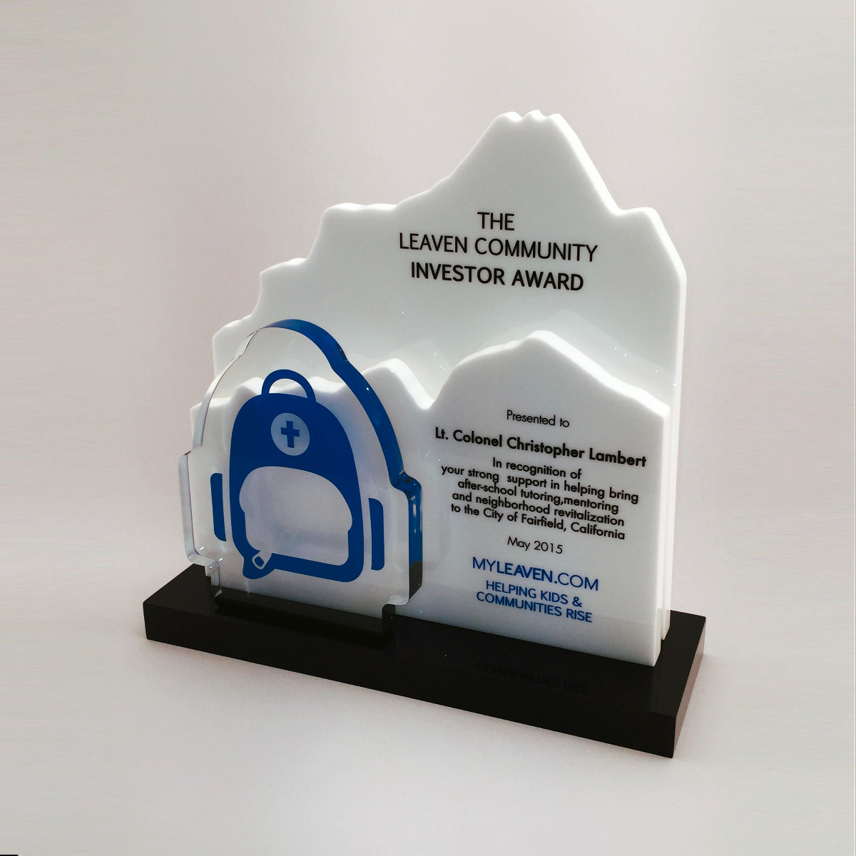 Custom shapes of mountain and backpack on black base award or trophy