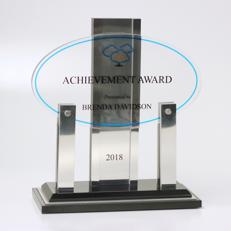 Custom shaped award using 2 different materials metal & acrylic.