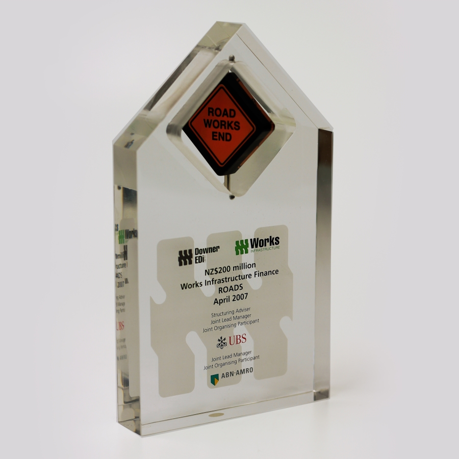 Custom shaped interactive motion Lucite award or trophy with diamond shaped spinner